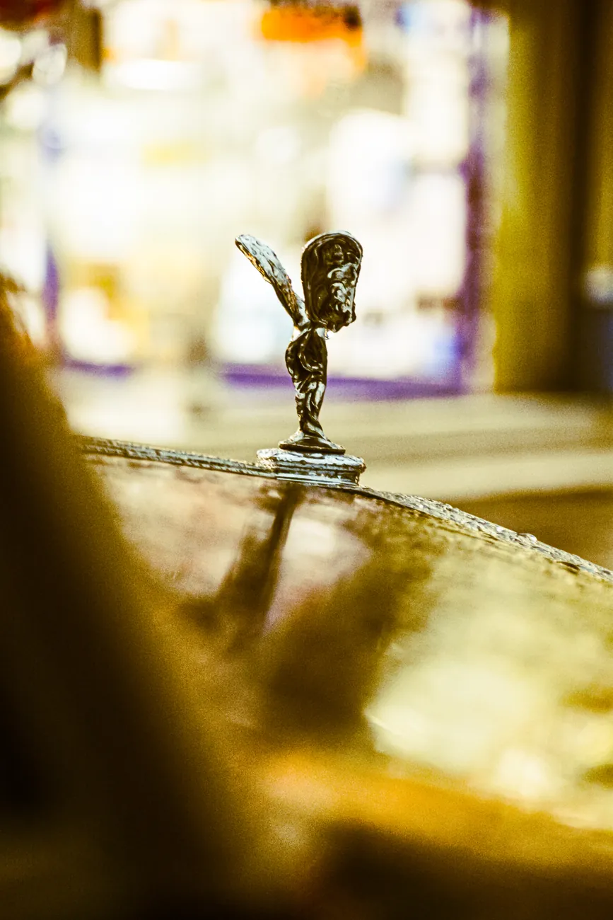Rolls-Royce Spirit of Ecstasy in warm bokeh